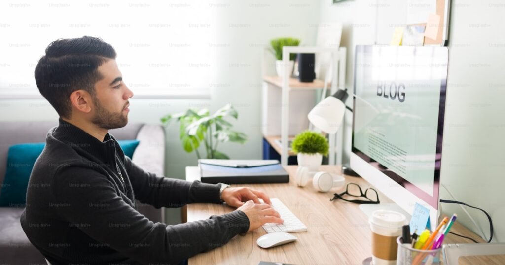 Blog writing on keyboard with coffee